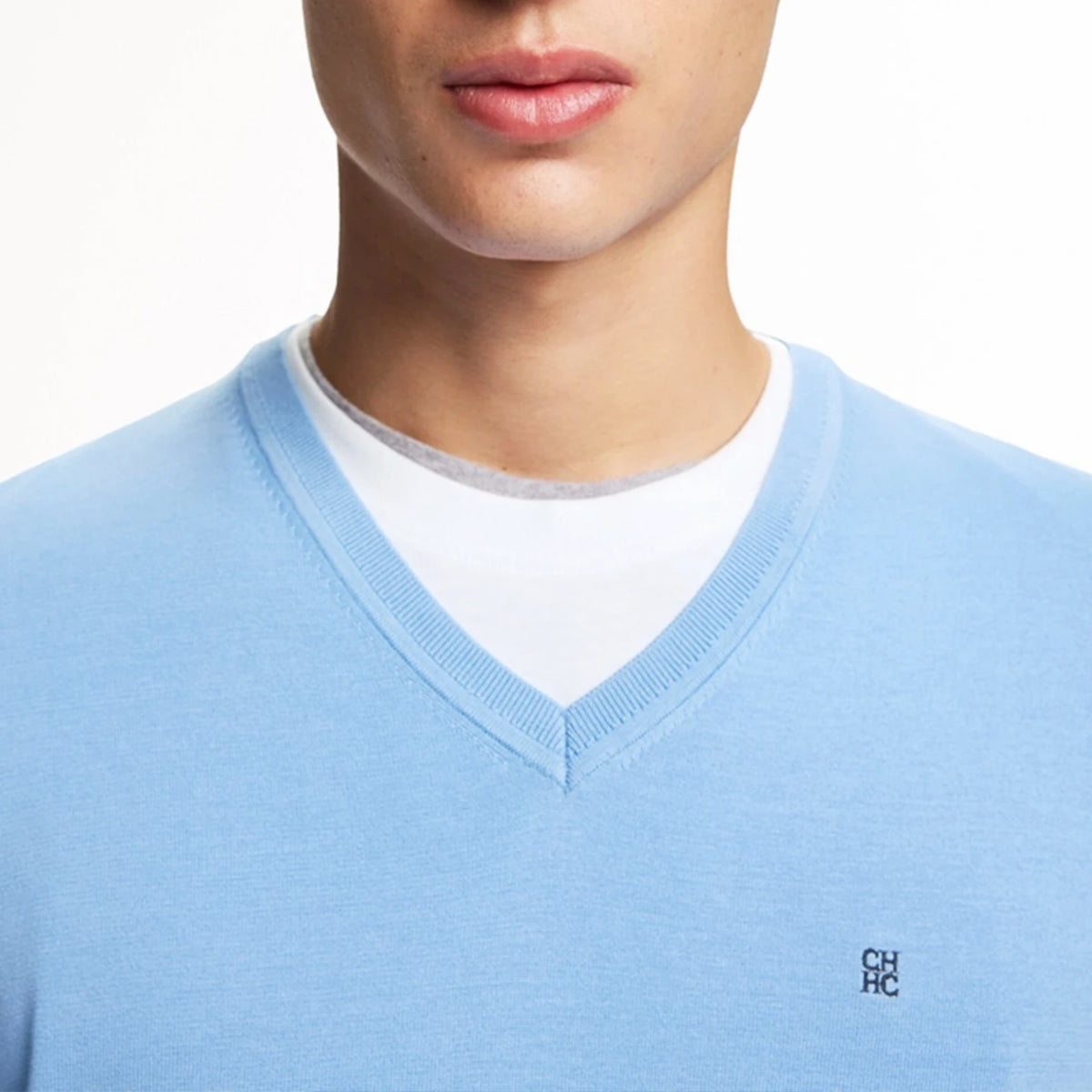 Men's Embroidered V-Neck Knit Sweater worn by a model showcasing its refined style and blue color.